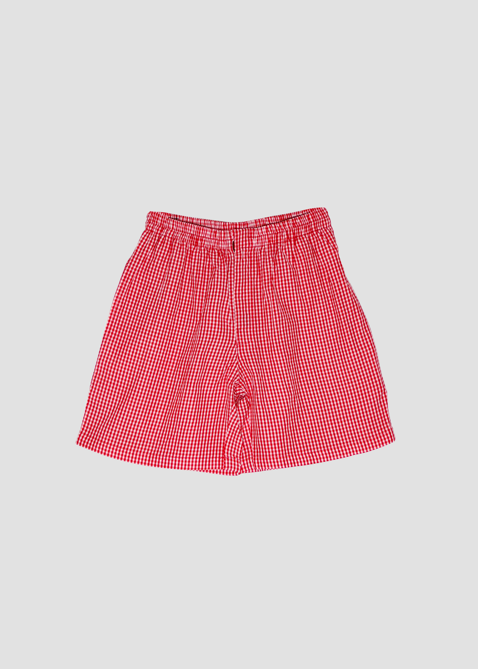 Pantaloncini estivi da donna in cotone a quadretti rosso, IGI AMA, 100% cotone leggero, chiusura con bottone e zip, vita elasticizzata, taglia unica, made in India, perfetti per outfit casual e look vacanza.