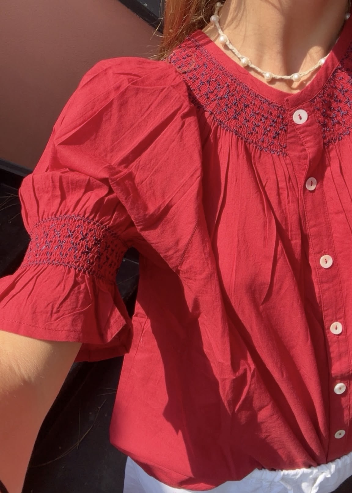 Bougainville red shirt worn by model IGI AMA