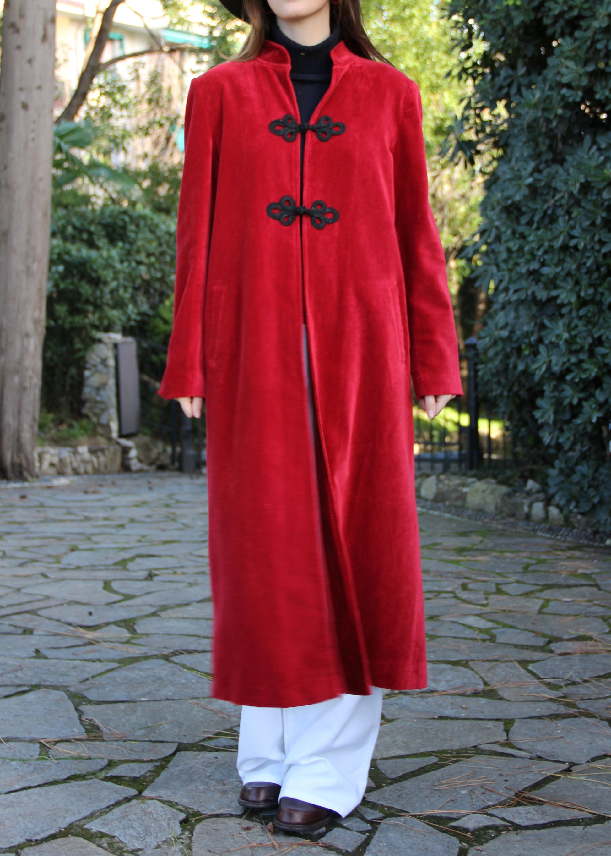 Alamari Coat in Red/Black Alamari, velvet red coat with black alamari, mandarin collar, and frog buttons. Structured shoulders and polyester lining. Made in India with an elegant and refined design. Dry clean only, iron on low heat, do not bleach.