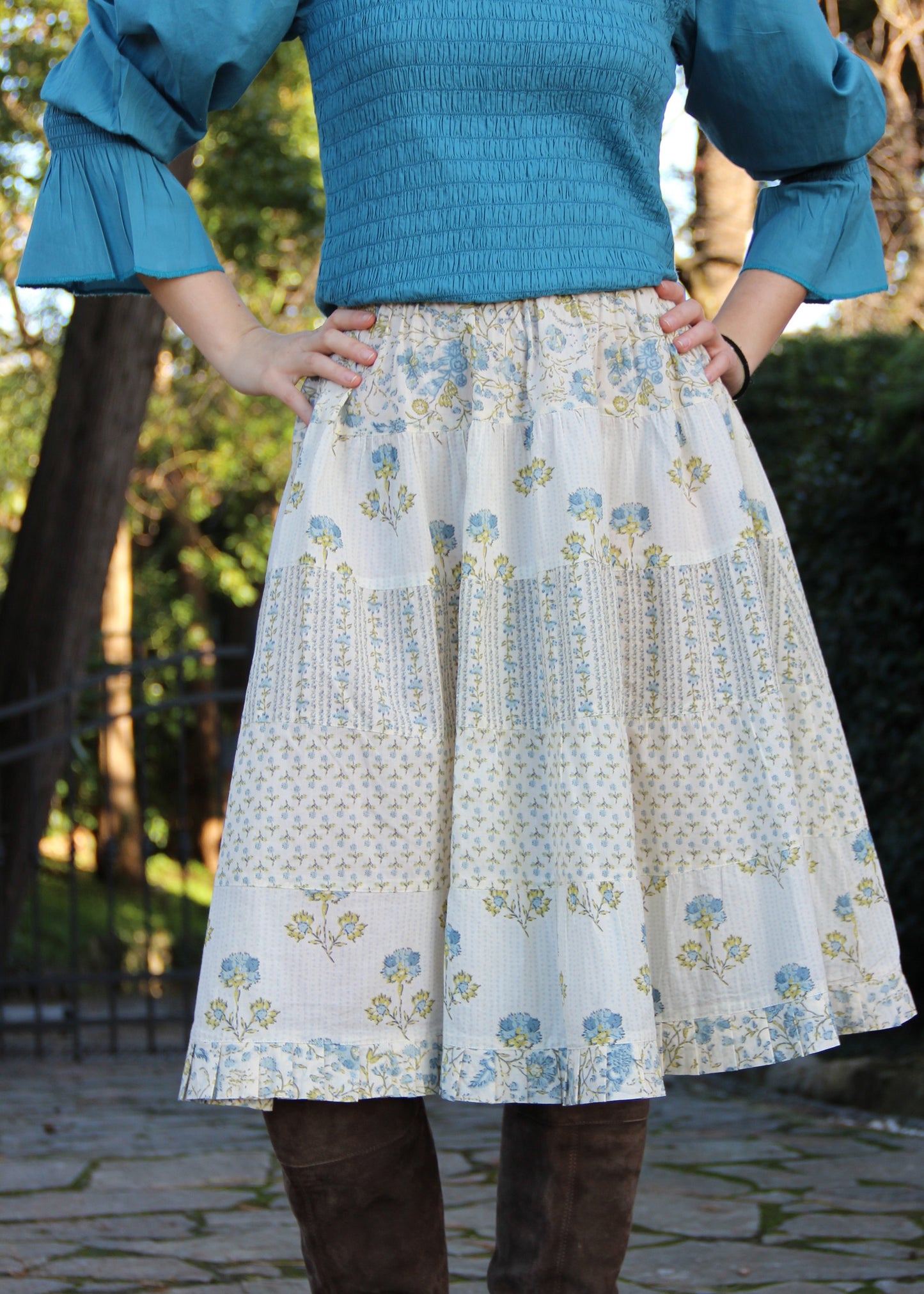 Hidi Midi Skirt in Blue, blue striped skirt with different floral patterns. Made from 100% patterned cotton, the Hidi Midi Skirt is elastic and fits all body types. Block printed pattern. Machine washable at 30°C, iron at low heat, made in India.