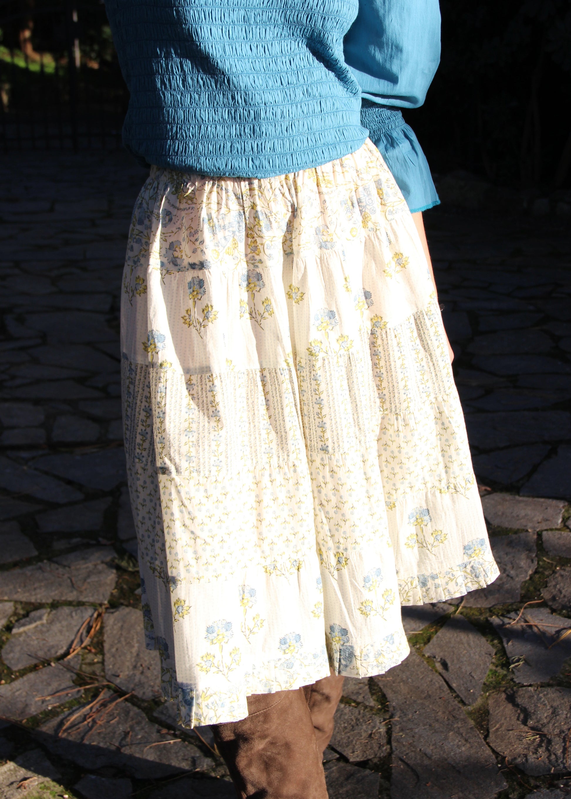 Hidi Midi Skirt in Blue, blue striped skirt with different floral patterns. Made from 100% patterned cotton, the Hidi Midi Skirt is elastic and fits all body types. Block printed pattern. Machine washable at 30°C, iron at low heat, made in India.