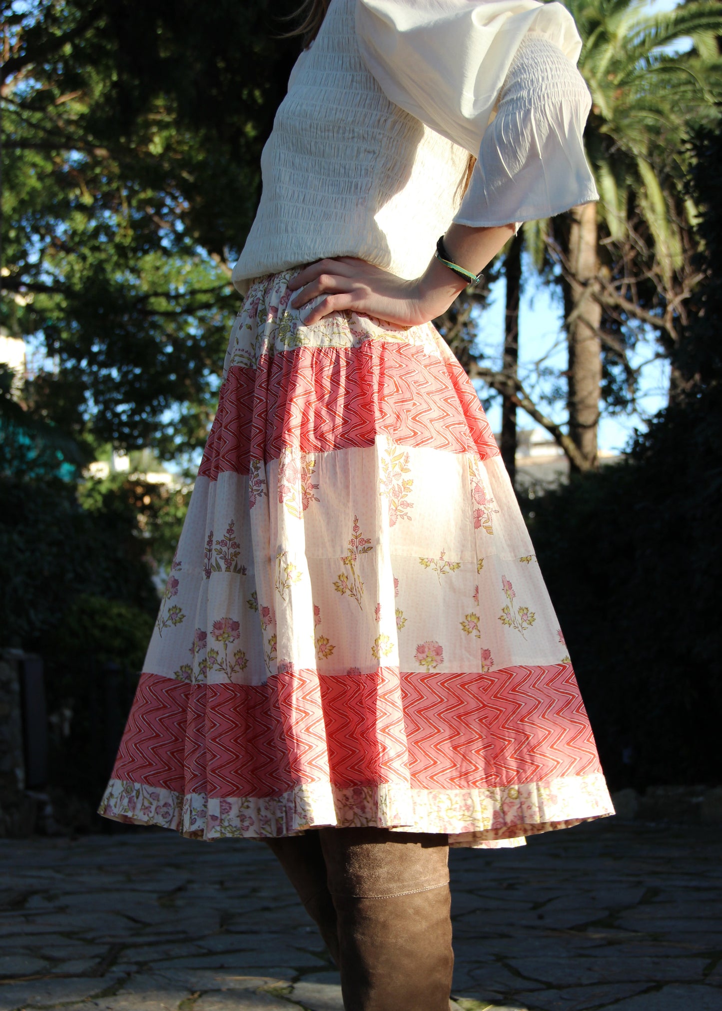 Hidi Midi Skirt in Pink, pink striped skirt with floral and zig zag pattern. Made from 100% patterned cotton, the Hidi Midi Skirt is elastic and fits all body types. Block printed pattern. Machine washable at 30°C, iron at low heat, made in India.