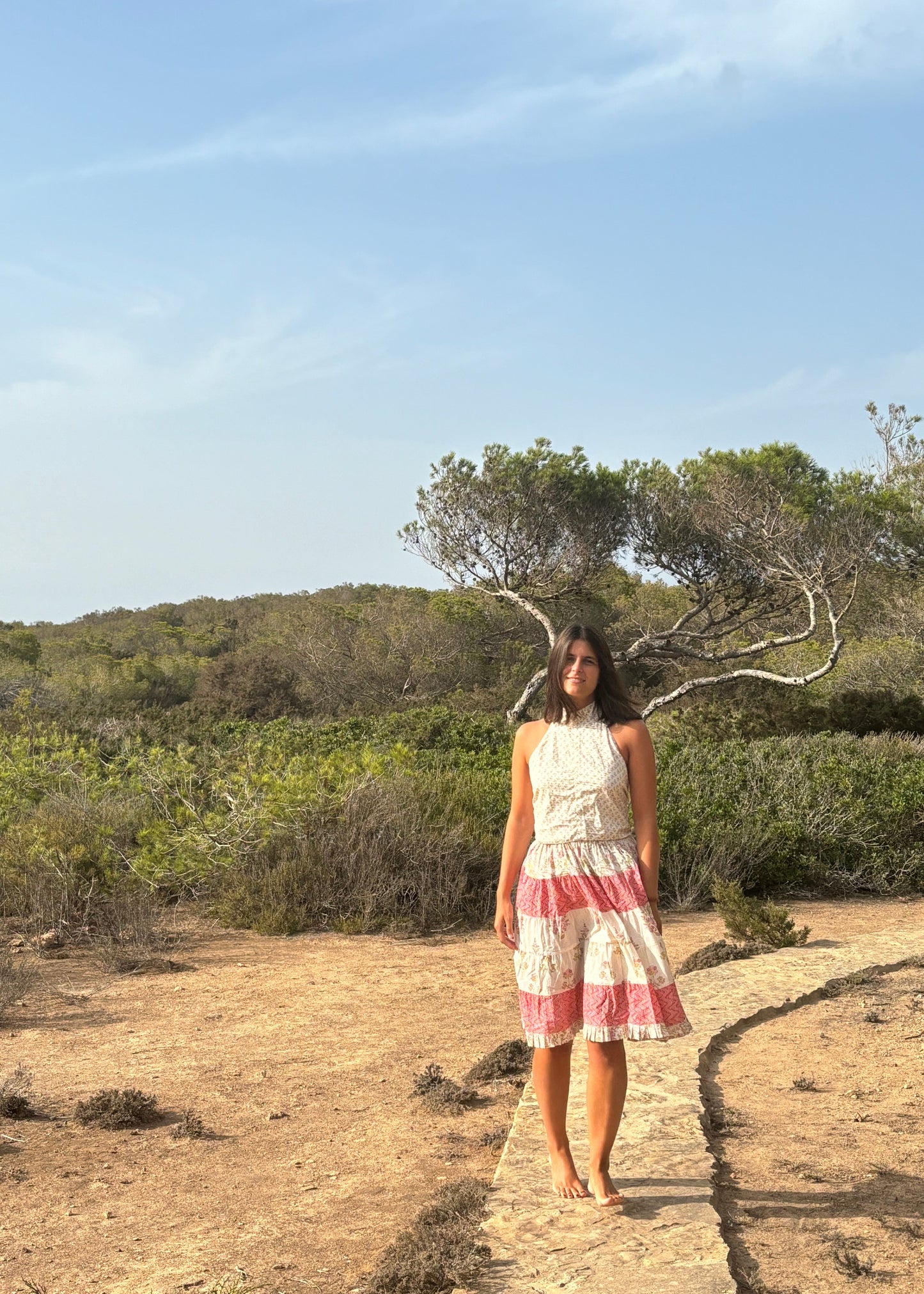 Hidi Midi Skirt in Pink, pink striped skirt with floral and zig zag pattern. Made from 100% patterned cotton, the Hidi Midi Skirt is elastic and fits all body types. Block printed pattern. Machine washable at 30°C, iron at low heat, made in India.